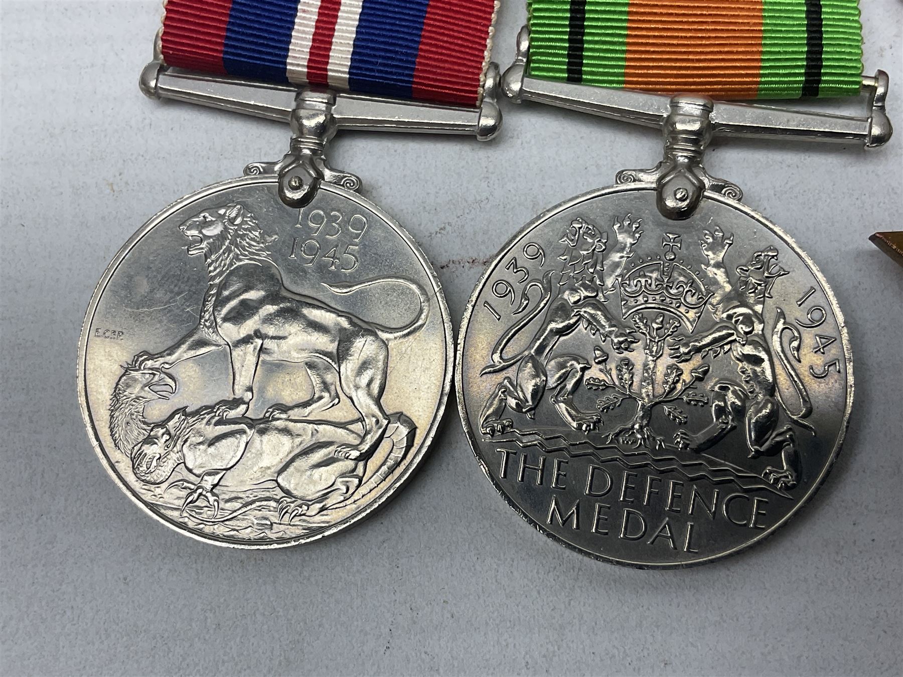 WW2 group of four medals comprising 1939-1945 War Medal, Defence Medal, Italy Star and 1939-1945 Star; with Royal Army Service Corps cap badge and RASC chrome and enamel sweetheart brooch