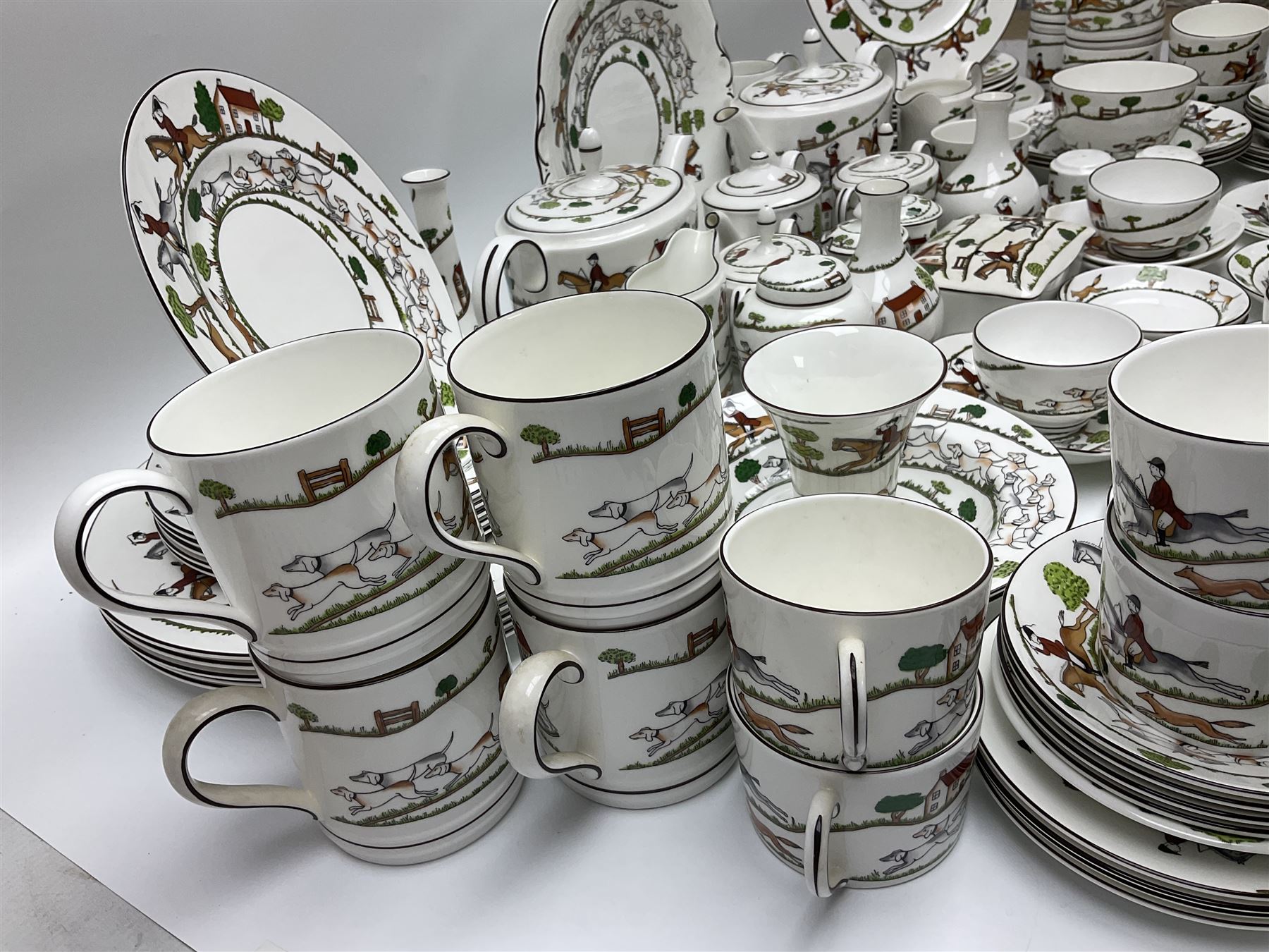 Wedgwood Hunting Scenes dinner and tea service for ten, to include dinner plates, side plates, dessert plates, cups and saucers, mugs, two large teapots, two milk jugs, etc, together with matching items by coalport and Staffordshire (94)