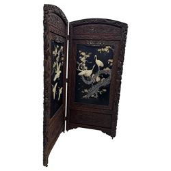 Meiji period (1868–1912), Shibayama lacquer carved hardwood two-fold screen inlaid with mother-of-pearl, bone, and ivory, decorated on one side in high relief and inlaid in a  Shibayama manner with oriental storks flying below flowering branches,  the reverse lacquer panels depicting flowering cherry trees. This item has been registered for sale under section 10 of the APHA Ivory Act.