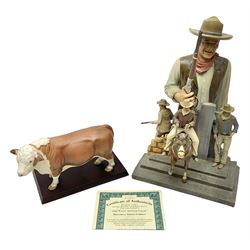 Beswick matte Hereford Bull, with stamped mark beneath, on wooden plinth, together with a limited edition Bradford Exchange John Wayne model, tallest H36cm