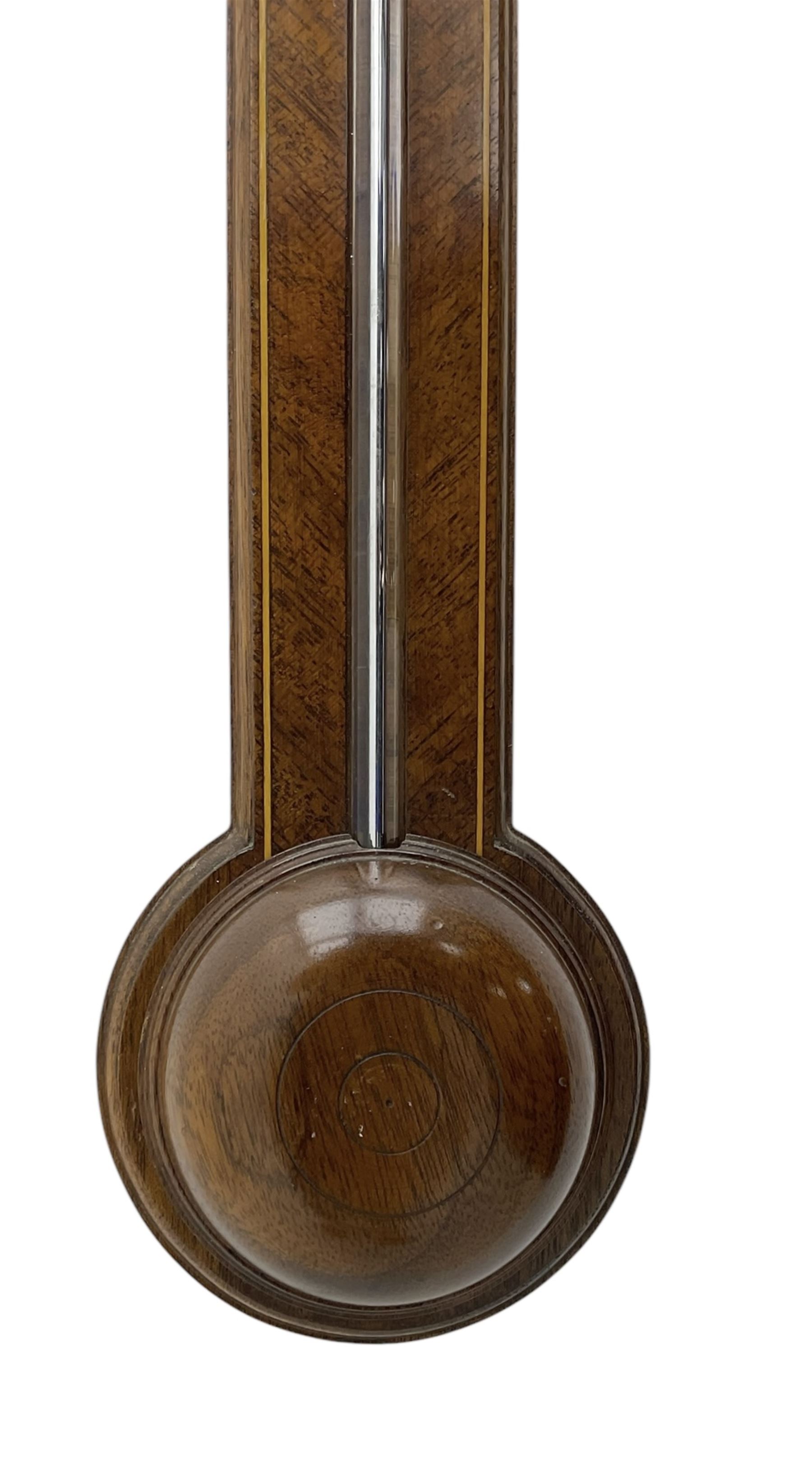 Comitti-20th century mercury stick barometer in an 18th century style mahogany case with satinwood stringing, with a broken pediment, brass finial and round base, silvered register with recording vernier, weather predictions and a centigrade/Fahrenheit spirit thermometer enclosed within a glazed door, visible tube with a bulb cistern and turned mahogany cover.
Mercury clean and present with no air locks.