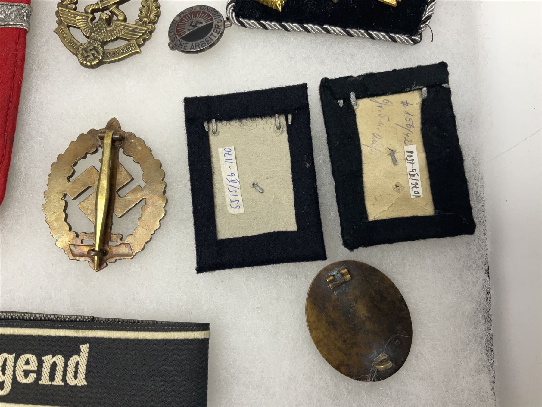 WW2 German Don Cossack epaulettes; and quantity of German insignia including SA Sports Badge for war wounded, Hitler Youth badge, Young Cossacks badge, Wound badge, Hitler Youth cuff title etc; in glass topped display box.