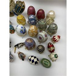 Quantity of decorative eggs to include musical examples, together with other figural decorative boxes etc