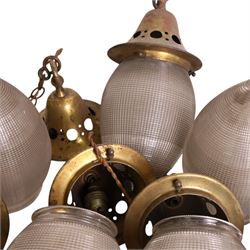 Set of eight French Art Deco Blondel Holophane pendant lights, the glass acorn shades, with pierced brass fittings, shades H35cm
