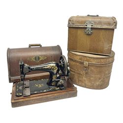  Metal hat box, together with another metal traveling case and a singer sewing machine 