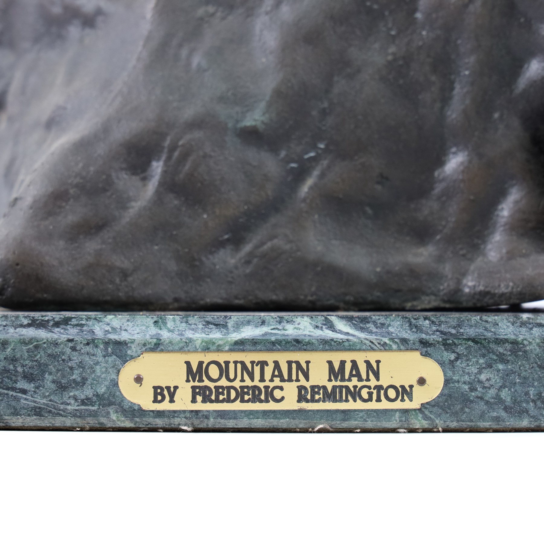 After Frederick Remington; The Mountain Man bronzed spelter figure of a native American trapper upon a marble base with plaque, H72cm