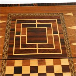 19th century mahogany fold-over card table, the crossbanded rectangular top opening to reveal an inlaid games centre with chessboard and backgammon designs, raised on turned and reeded legs with extending rear supports