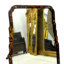 Early 20th century wall hanging tortoise shell framed mirror, of rectangular form, the upper half of the frame shaped and stepped surrounding a plain mirror plate
