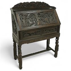 Early 20th century Chinese export carved hardwood writing bureau, the sloped fall front de...