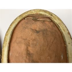 Pair of 19th century classical terracotta relief wall plaques depicting the goddess Hygeia and another goddess, seated holding an ewer, each of oval form, indistinctly signed, each stamped Ferreira verso, H42cm, W30cm