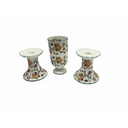 Minton Haddon Hall pattern tea and dinner wares, including basket dish, two covered tureens, six dinner plates, eight dessert plates, twelve tea plates, six soup bowls, six cereal bowls, teapot, coffee pot, milk jug, covered sucrier twelve tea cups and saucers, six mugs, footed bon bon dish, pair of candlestick holders, cake knife and slice etc (81)