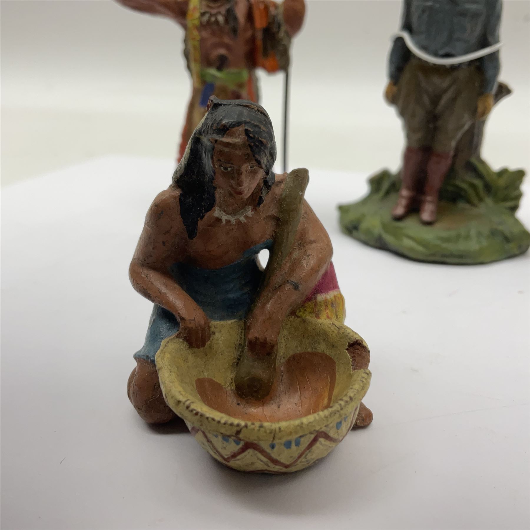 Five Elastolin American Indian figures, together with an Elastolin campfire and a cowboy tied to a tree, tallest H11cm