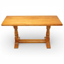 Sid Pollard of Thirsk - Yorkshire oak coffee table, rectangular adzed top with softly moulded edge, raised on twin octagonal baluster supports, united by a plain stretcher, on shaped splayed feet