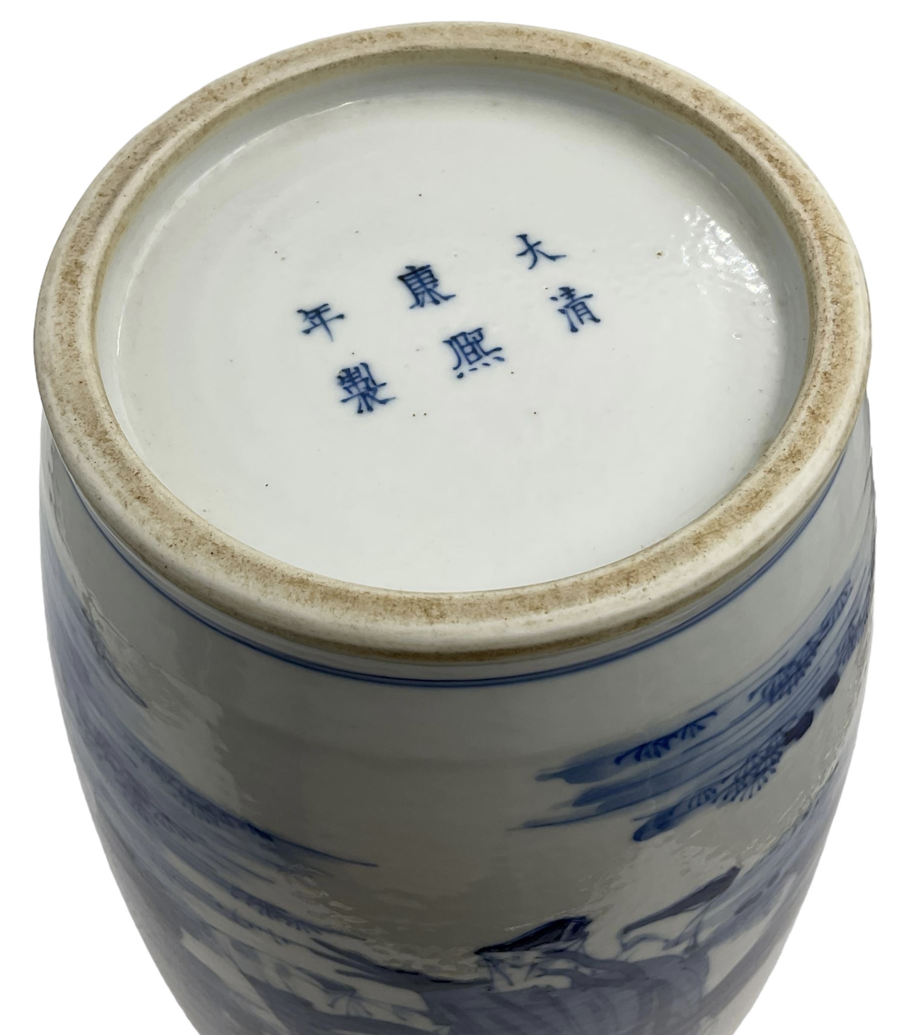 A Chinese blue and white Qing dynasty style vase, painted in underglaze blue with figures in a rocky landscape, six character Kangxi type mark to base, H34cm