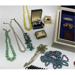 Costume jewellery including brooches, necklaces etc, housed in a modern jewellery box