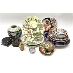 A group of 20th century and later Oriental ceramics, mostly comprising a number of Imari plates of various size including a fan shaped dish, plus three plates decorated with birds perched upon blossoming branches, etc. 