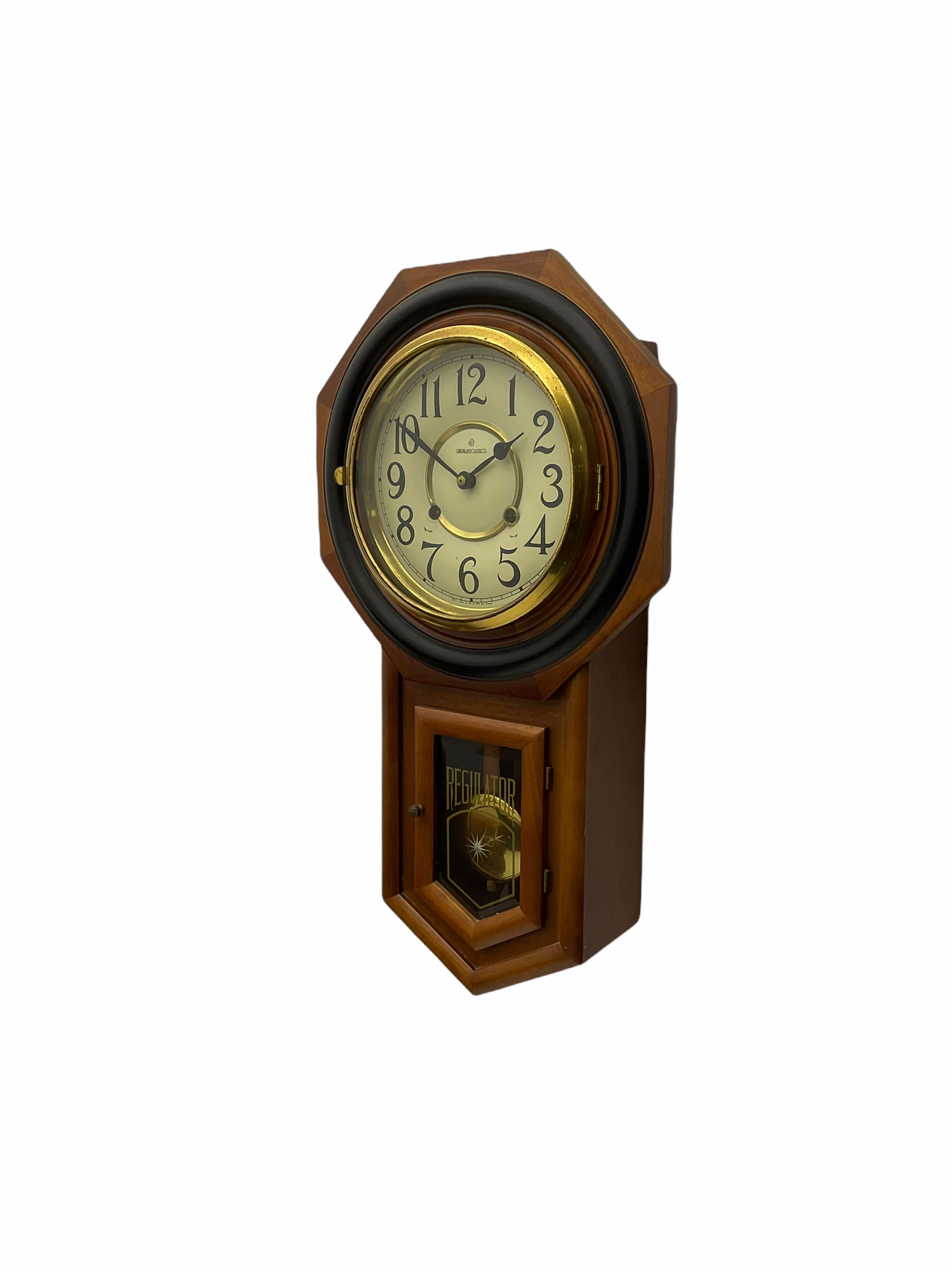 Contemporary spring driven wall clock striking the hours on a gong