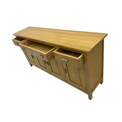 G-Plan - light oak sideboard, fitted with three drawers and four panelled cupboards