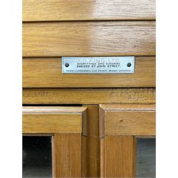 Haberdashery display cabinet with plaque ‘J.C. King Ltd, Shop fittings & Sundries, St John's Street London’, sixteen glazed front short drawers, above four deep drawers