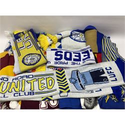 Collection of Leeds United scarves, hats and t-shirts, together with a Washington Redskins NFL sweatshirt and an Australian rugby league shirt