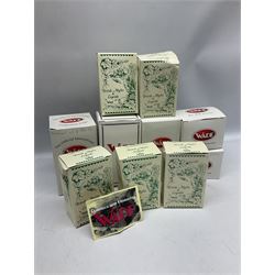 Nine Wade Collectables figures, comprising six Myths and Legends; King Canute, Mermaid, St George, Cornish Tin Mine Pixie, Puck and Green man, together with Lamb, Elephant and bear, a Wade Panda money box and two boxes of Wade Christmas Crackers