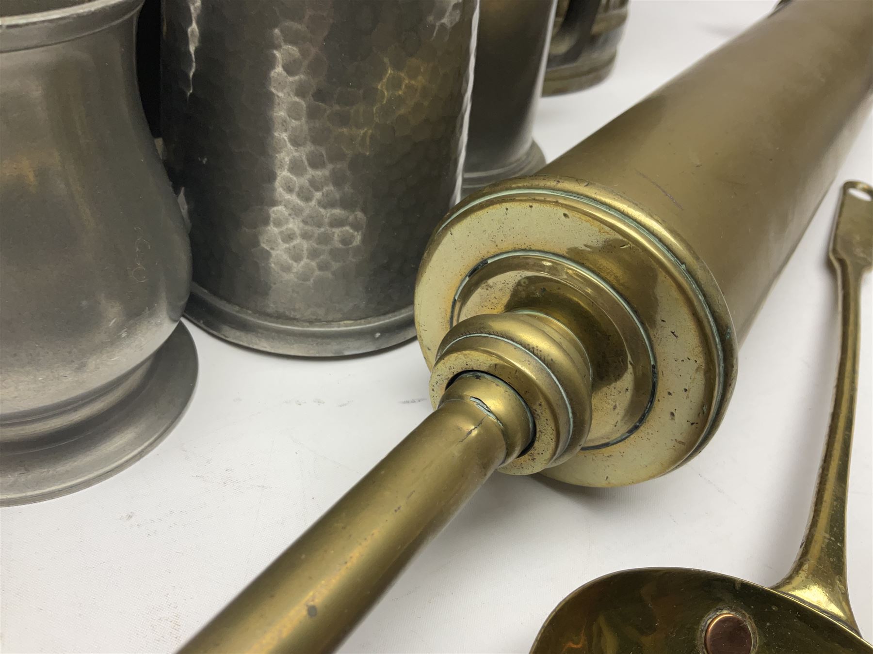 Victorian brass veterinary syringe, with wooden handle, inscribed 'to be returned to J.Cooke FRCV Scarboro' together with a brass jam pan, coal scuttle and spoon and four pewter tankards