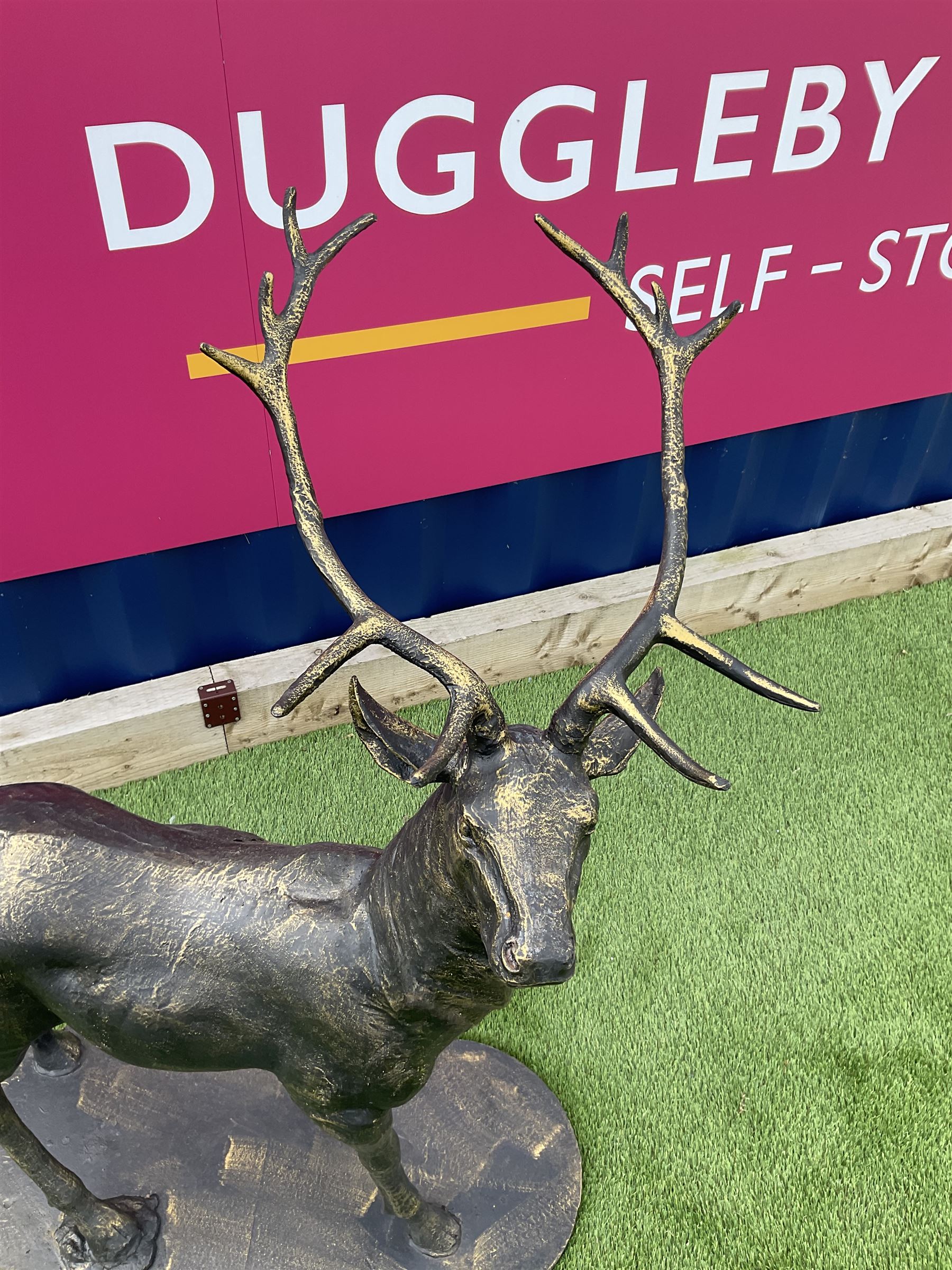 Bronzed cast iron life-size garden or indoor Stag, oval plinth base - THIS LOT IS TO BE COLLECTED BY APPOINTMENT FROM DUGGLEBY STORAGE, GREAT HILL, EASTFIELD, SCARBOROUGH, YO11 3TX