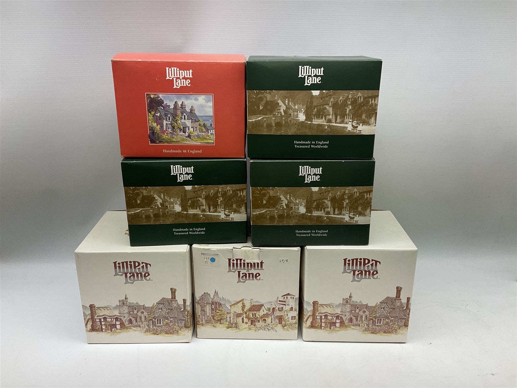 Seven Lilliput Lane cottages from the British and English collections, to include Paradise Lodge, Traveller's Rest etc, all boxed with deeds