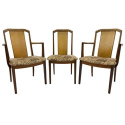 G-Plan -  1970s teak extending dining table, pull-out extending action with fold-out leaf, rectangular end supports on sledge feet united by stretcher (100cm x 160cm - 205cm, H73cm); set of six dining chairs, chevron-patterned backrests upholstered with floral patterned fabric, on tapered legs, H89cm