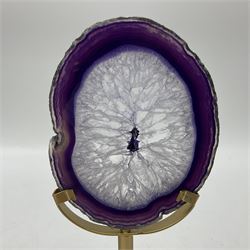 Pair of purple agate slices, polished with rough edges raised upon gilt metal stands