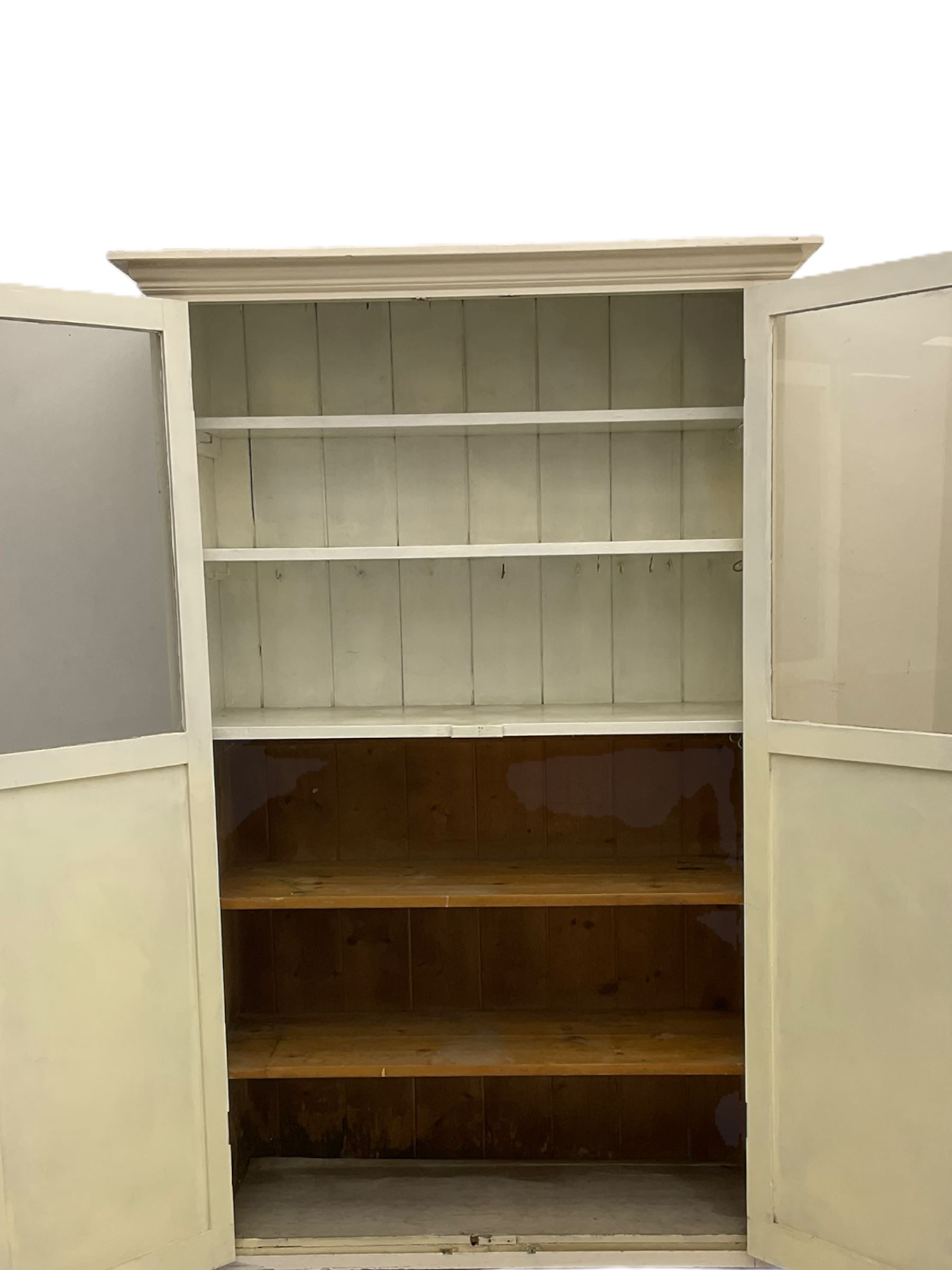19th century painted pine kitchen cupboard, enclosed by two part glazed doors
