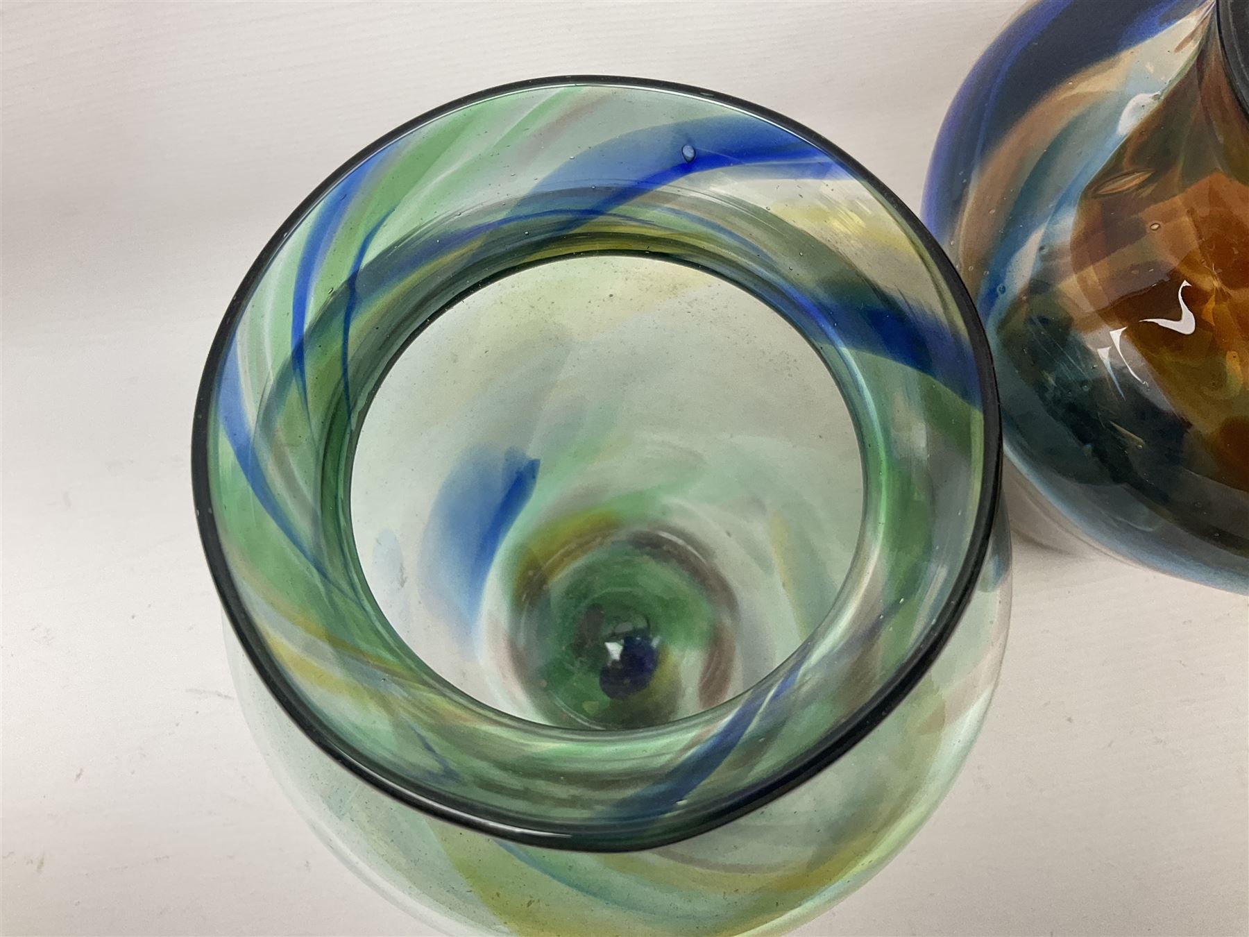 Three Hartley Wood coloured glass vases, each of baluster form with swirling decoration, tallest H21cm