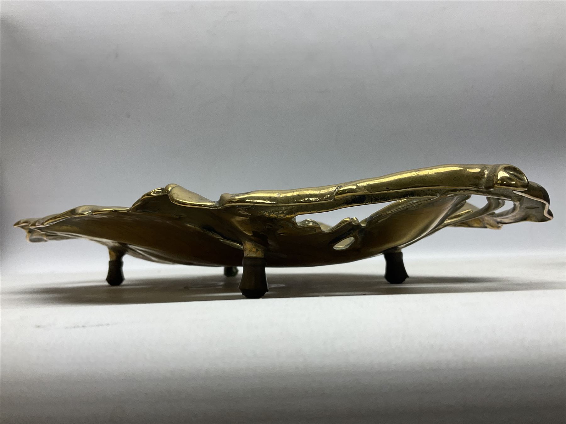 Late 19th/early 20th century twin handled brass centrepiece dish in the form of oak leaves, raised upon four legs, L37cm