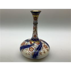 Late 19th century Moorcroft Macintyre Aurelian ware vase, of squat bottle form with tall neck and flared rim, with printed mark beneath, H16cm, together with an early 19th century miniature Stevenson and Hancock Derby vase, of bulbous form with short neck, decorated in the Imari palette, with painted mark beneath, H6cm, (2)