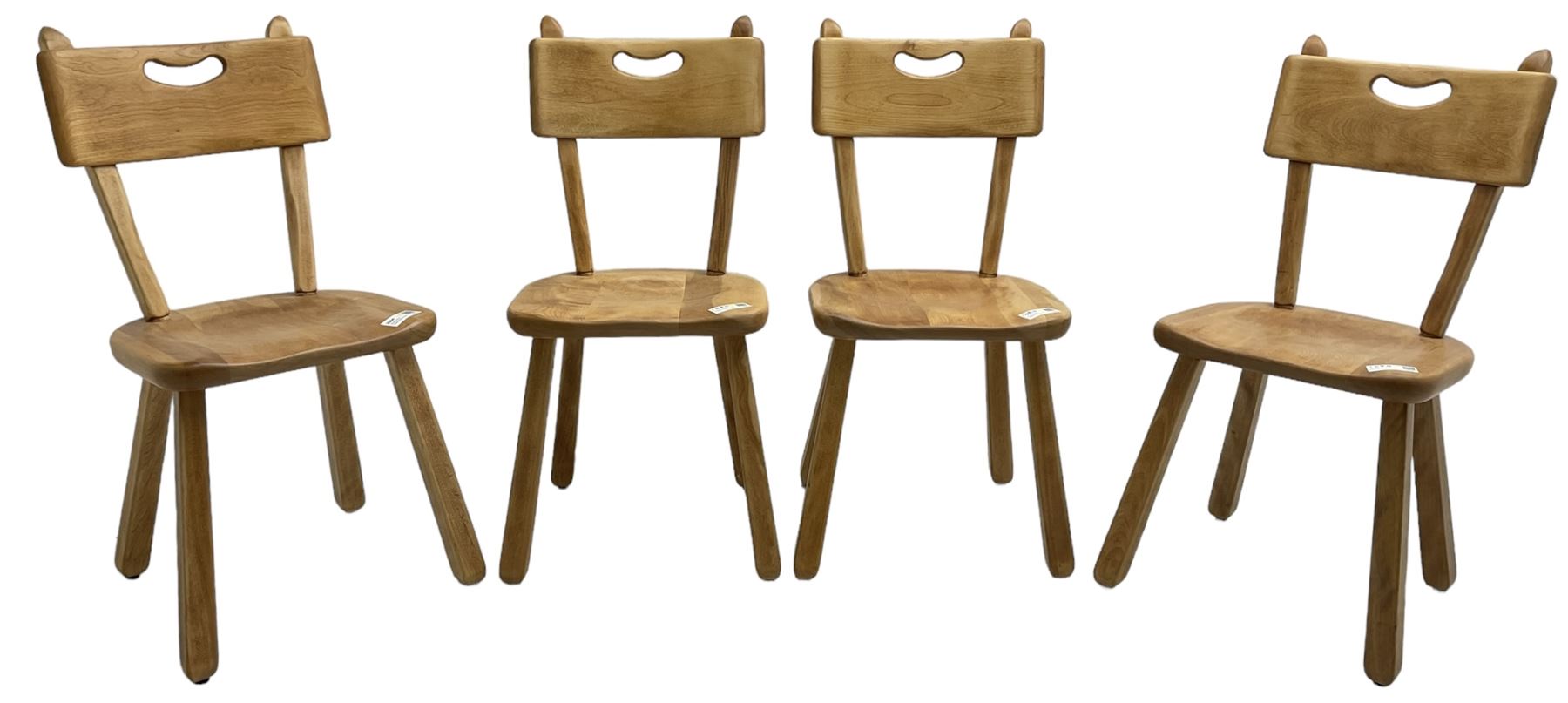 Imperial Canada - set of four mid-20th century birch dining chairs, bar back with pierced handle, dished seat on square tapered splayed supports