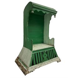 19th century painted pine hen coop settle, overhanging arched canape with dentil moulding and shaped edge, the panelled seat over a triangular platform base with removable hen-coop door, in green and white finish