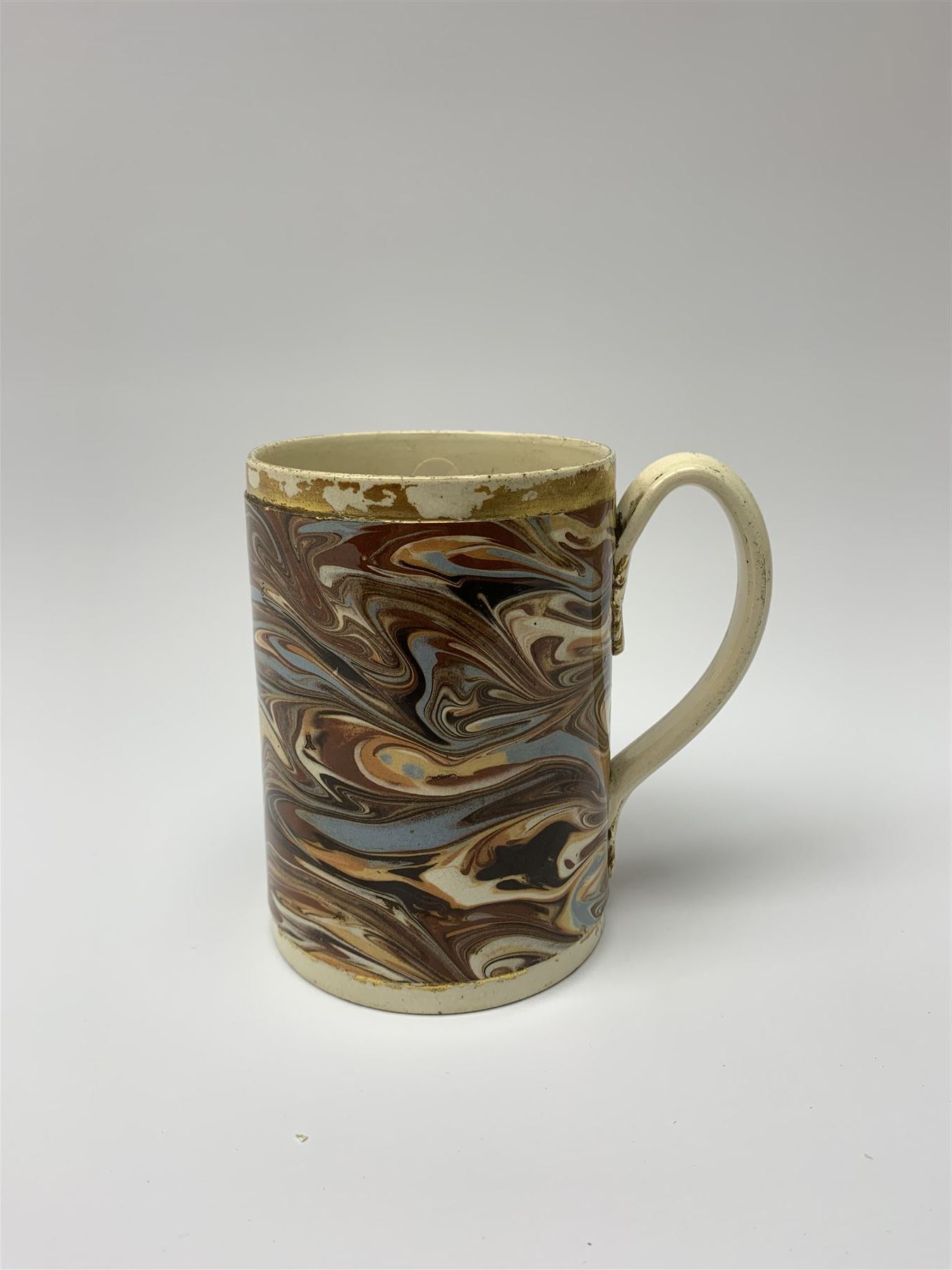 Late 18th century earthenware mug, possibly Ralph Wedgwood, Burslem or Ferrybridge, with surface marbled decoration and later gilt detail to rims and handle, impressed beneath Wedgwood & Co, H12cm