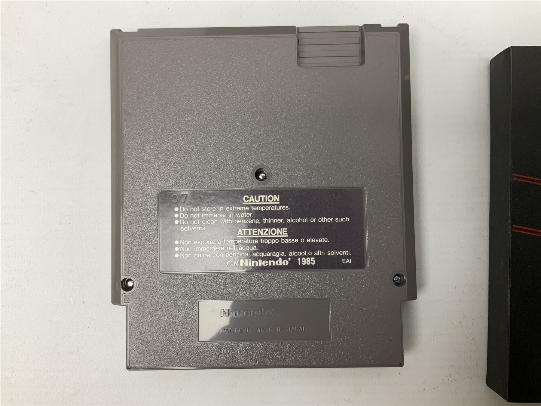 Nintendo Entertainment System (1985) console with two controllers, accessories and instruction booklet. NES Games ‘Duck Hunt’ with Nintendo Zapper gun, ‘Pinball’ and ‘Super Mario Bros.’, all with original sleeves and instruction booklets. NES game ‘Super Mario Bros. 2’ cartridge only