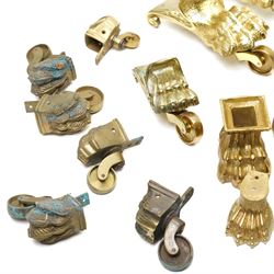 Set of four period design lacquered brass paw furniture castors by Beardmore, London, set of four matching smaller castors and a quantity of various brass castors   
Provenance: property of a Nobleman