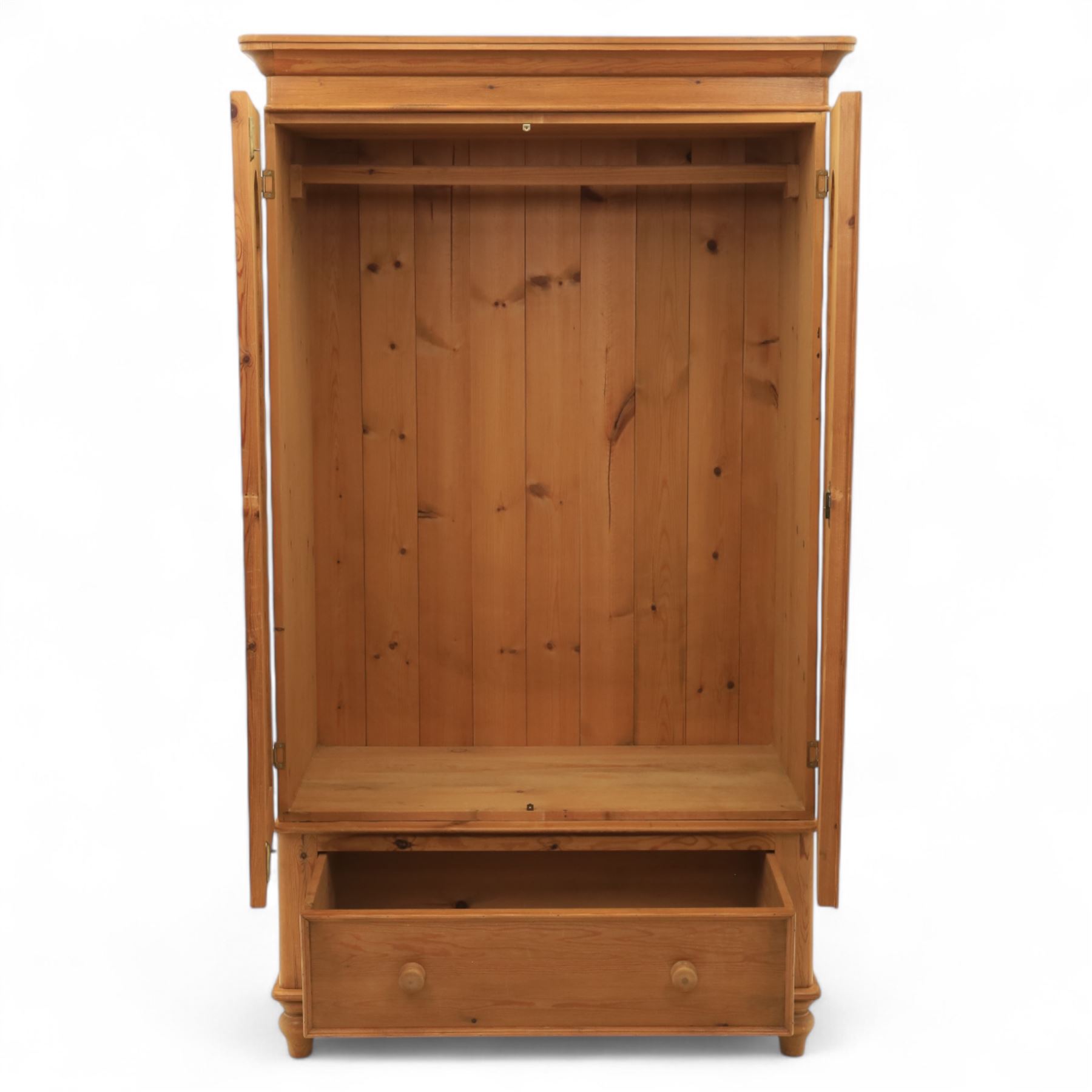 Two contemporary traditional-style wardrobes, projecting plain cornice above two arched moulded panel doors, above a full-width drawer fitted with turned wooden handles, raised on turned bun feet