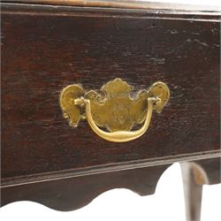 18th century oak lowboy, the rectangular top with moulded edge and eared front-corners, fitted with single drawer with pressed brass handle-plates, shaped apron over cabriole supports and pad feet