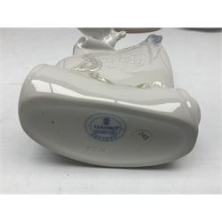 Three Lladro figures, comprising Dear Santa no 6166, Angelic Melody 1993 no 5963 and Seraphs Head no2 no 4885, together with Lladro plaque Love Brings Us Together no 7677, all with original boxes, largest example H18cm