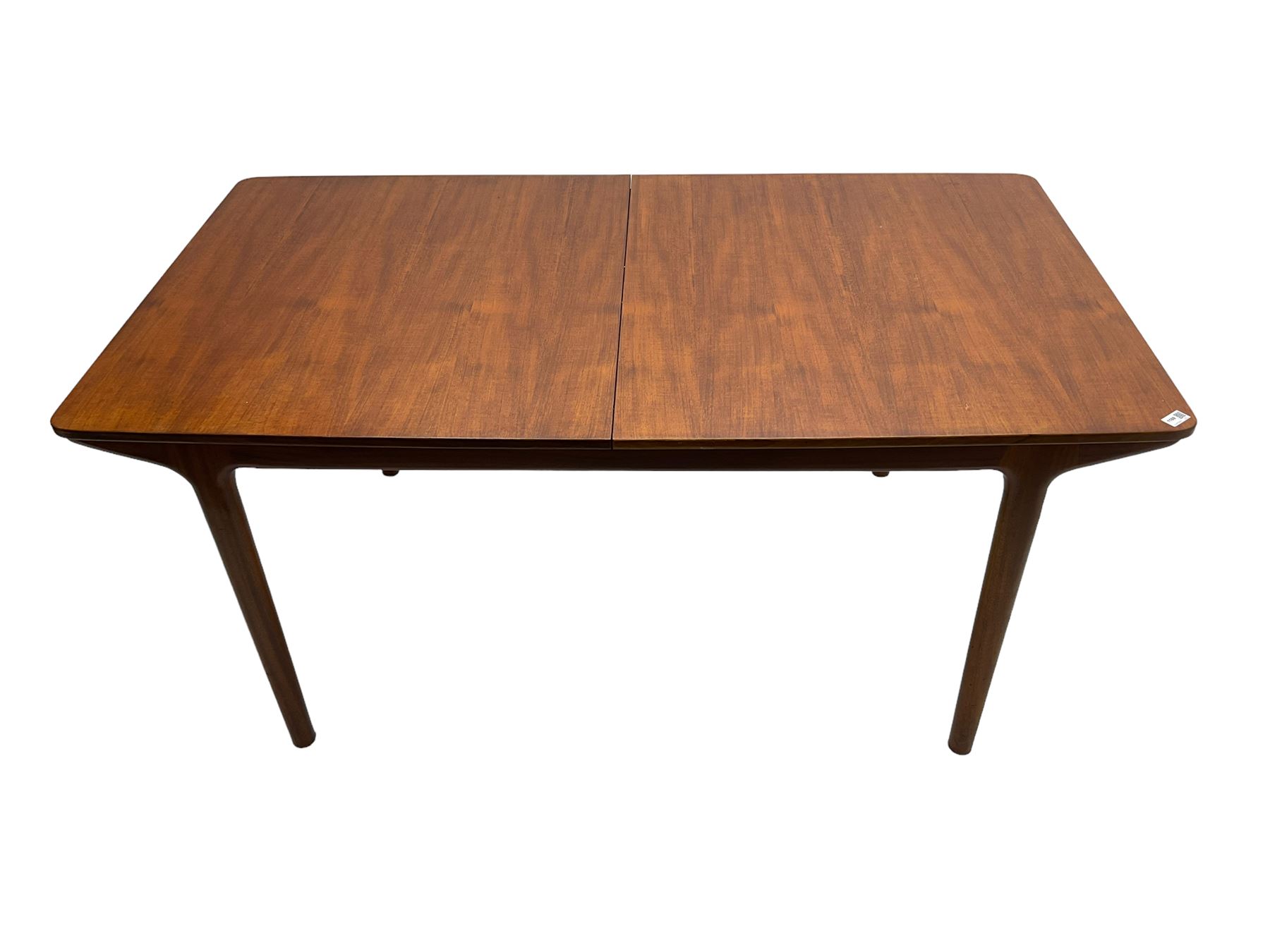 Tom Robertson for AH McIntosh & Co of Kirkaldy - mid-20th century teak extending dining table, rectangular top with rounded corners, concealed integrated double leaf, raised on tapered supports, metal label to underside of leaf