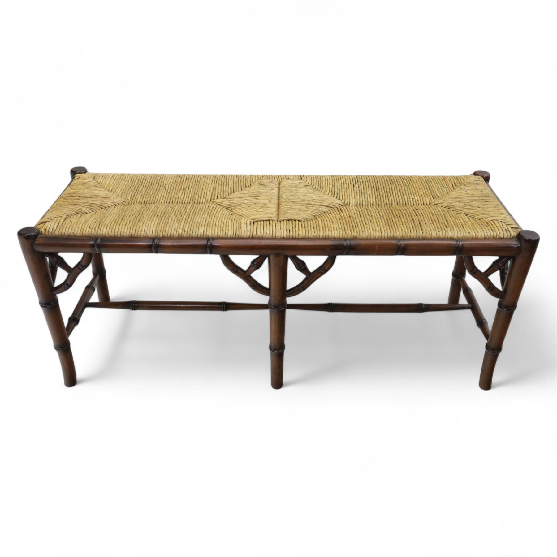 Faux bamboo long stool, stained beech frame with rectangular rush woven seat, rounded rail sides over ring-turned supports, united by side and end stretchers