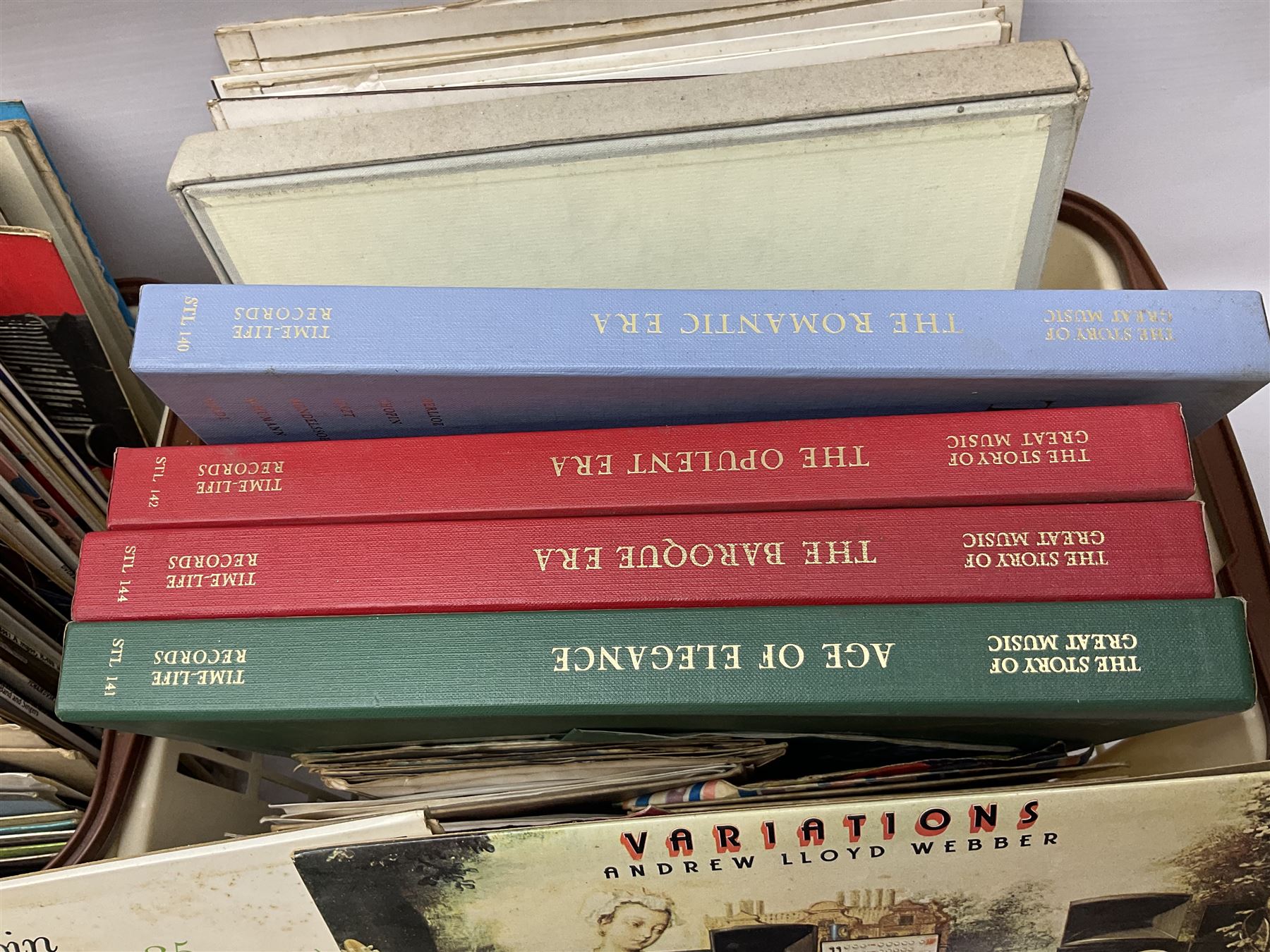 Wooden magazine rack, with floral detail, together with a collection of records, to include the box sets 'the Story of Great Music', 'Popmobility', Happy Holiday in Greece  etc, in three boxes 