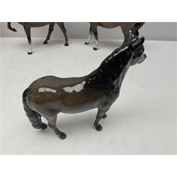 Four Beswick horses, including Exmoor no 1645, Black Beauty foal and two others 