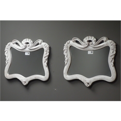  Pair small wall mirrors in ornate swept frames, 42cm x 53cm  