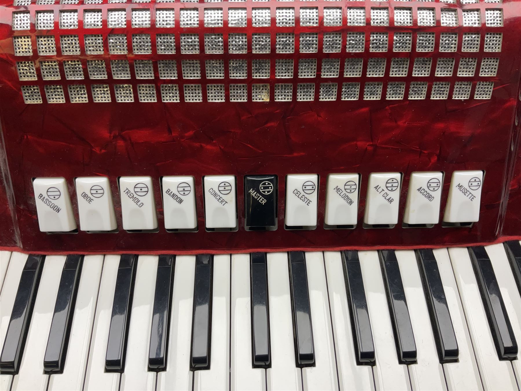 Clinkscale Crucianelli piano accordion in red pearline case with one-hundred and twenty buttons and forty-one keys L52cm; in carrying case