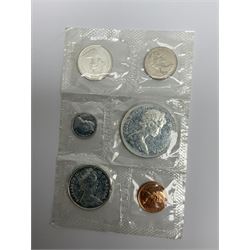 Mostly Canadian coins including 1967 six coin set, various Canadian 50 cent coins, various nickels, Royal Canadian Mint 1990 specimen coin set in blue folder with outer sleeve, various Canadian dollars etc, in folders and loose