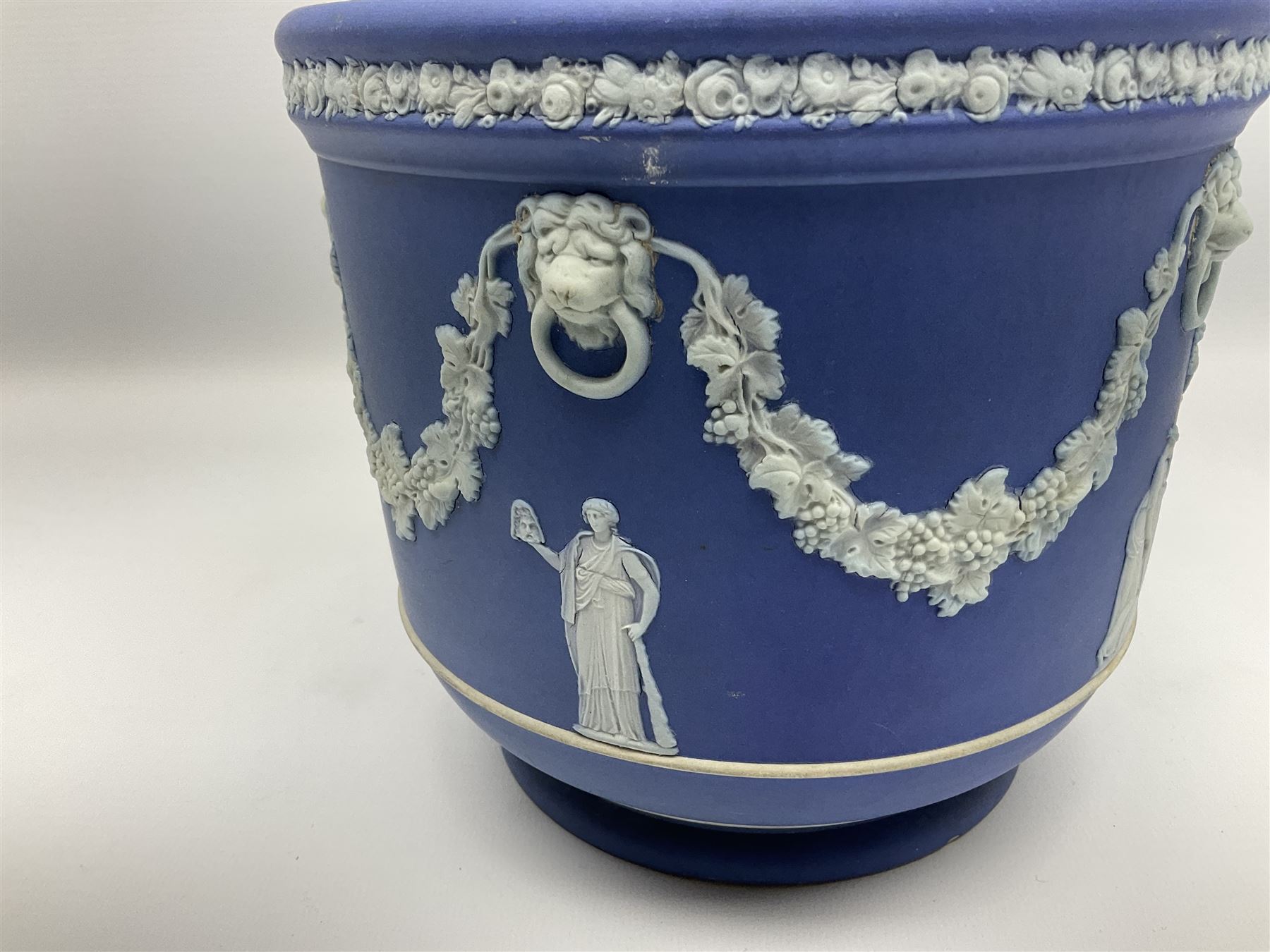 Victorian Wedgwood blue jasperware jardiniere H16.5cm; Victorian copper lustre jug; James Kent art deco style green glazed jug; and Beswick figure of a singing cat (4)